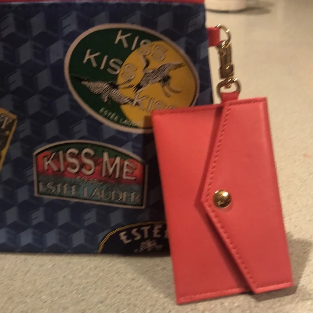 Estée Lauder Blue Travel pattern make-up bag w/Pink coin purse attached.